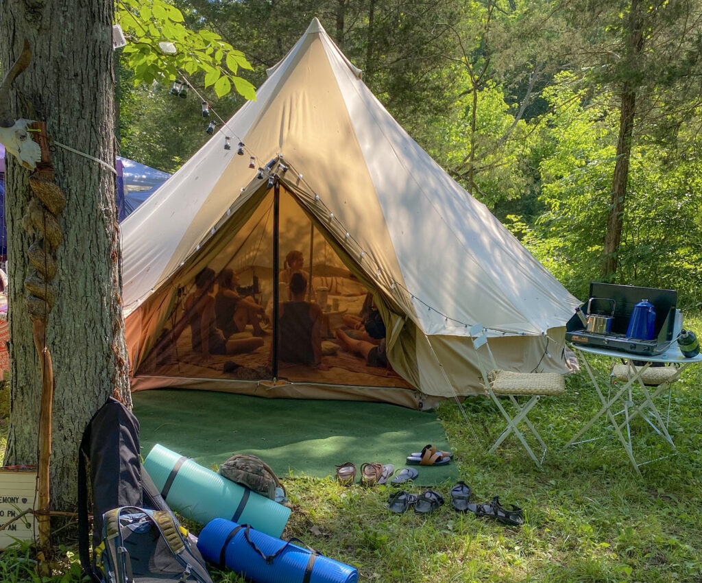 Mystic Den Yurt is a 20 foot tent for creating mushroom tea ceremonies at festivals.