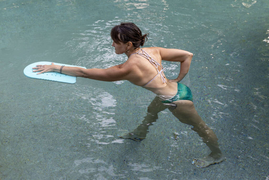 Debby Siegel practicing yoga in a pool